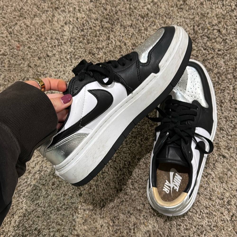 Black with silver Nike shoes
